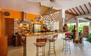 Villa Kaleidoscope kitchen bar with wooden stools, Seminyak