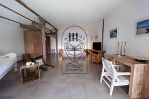 Villa Pachy bedroom with daybed, desk and vintage wooden beams
