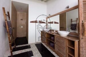 Villa Pachy bathroom with walk-in shower and pebble floor