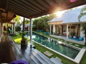 Villa Pachy pool and garden seen from the covered wooden deck