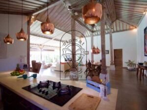 Villa Pachy open kitchen and living area with copper pendant lights