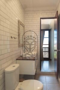Bathroom with subway tile and floating vanity at Villa Bugenvil