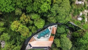 luxury Bali villa overlooking forest river and waterfall