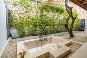 Tropical bathroom with bathtub in Bali villa