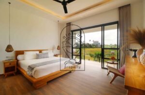 Villa Melati bedroom with king bed and ricefield view, Berawa Bali