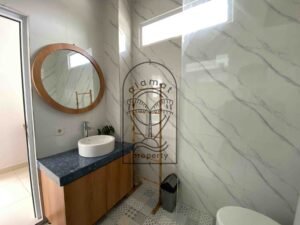 En-suite bathroom with modern fixtures and natural light at Villa Ramaia