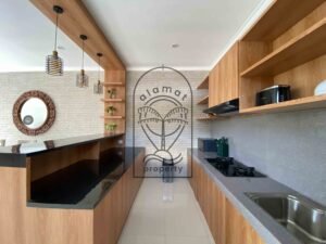 Fully equipped open kitchen with granite counters at Villa Ramaia