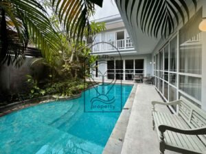 Private pool and tropical garden with pool deck at Villa Kemuning