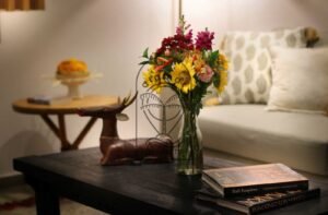 Villa Melati coffee table detail with wooden deer sculpture, Berawa Bali