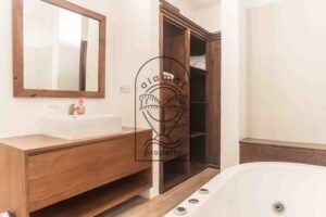 Bathroom with bathtub and closet in Villa Aruna Sari Bali