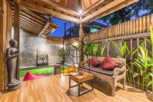 Joglo villa for daily rental in Berawa: Villa Puri Kasa pool terrace with Buddha statue