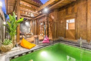 Villa Puri Kasa private pool surrounded by wooden joglo structure