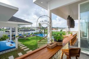 Teak terrace bar overlooking garden, pool, daybed and rice fields at Villa Jendari